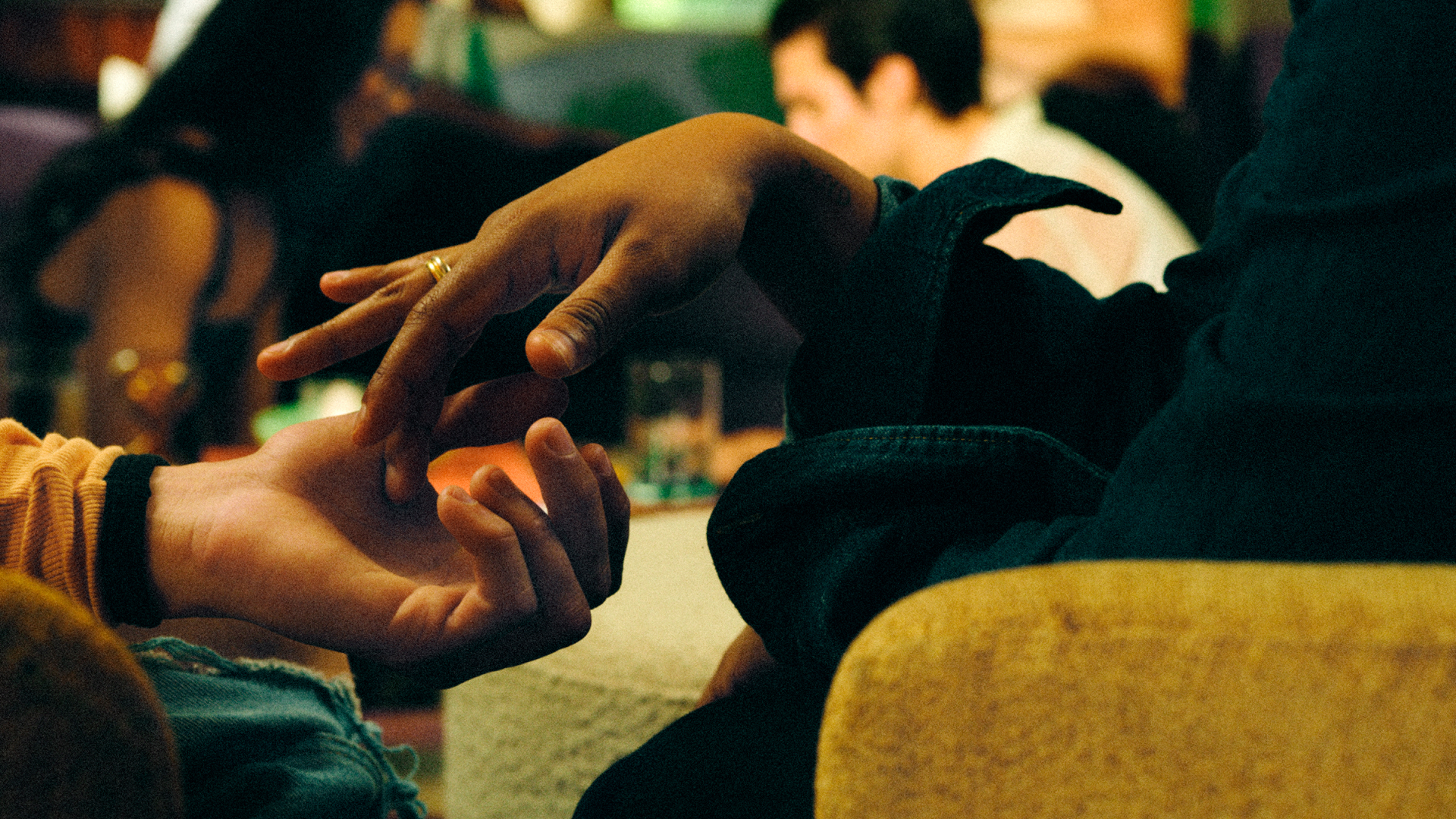 Two people touching hands